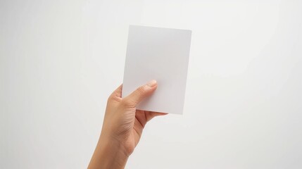 Fototapeta premium Election voting concept with hand and ballot paper on white background