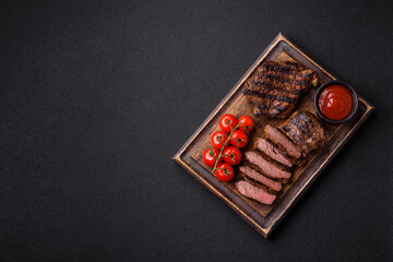 Fresh juicy delicious beef steak on a dark background