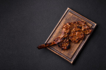 Juicy beef tomahawk steak on the bone baked on the grill