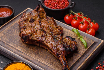Juicy beef tomahawk steak on the bone baked on the grill