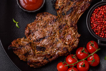 Juicy beef tomahawk steak on the bone baked on the grill