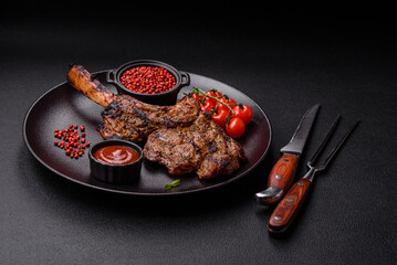 Juicy beef tomahawk steak on the bone baked on the grill