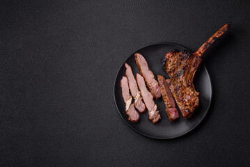 Juicy beef tomahawk steak on the bone baked on the grill