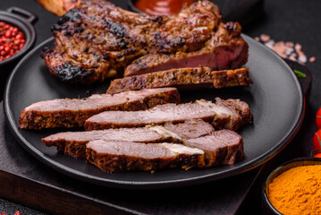 Juicy beef tomahawk steak on the bone baked on the grill