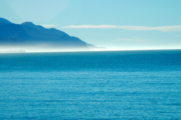 Strolling on the beach under the winter sun in New Zealand