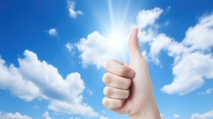 Vibrant outdoor image of hand giving thumbs up against blue sky symbolizing positivity, success, and approval.