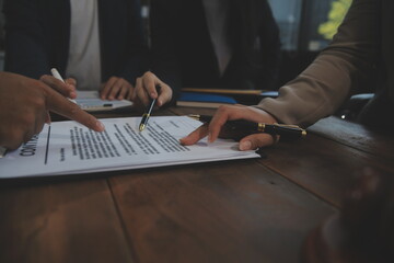 Judge gavel with Justice lawyers having team meeting at law firm background. Concepts of Law and...