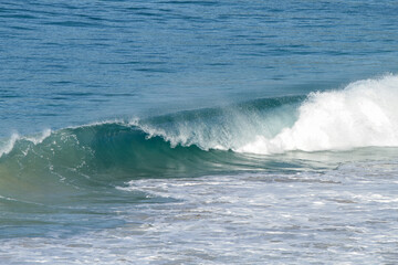Wave breaking on the shore in Forster, New South Wales