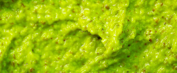 Smoothie with fresh green vegetables and fruits. Berry and yogurt ice cream. The texture of the sorbet. Delicious sweet dessert close-up as a background.