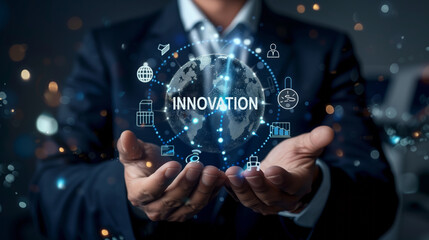 Naklejka premium Businessman holding a holographic globe with 'Innovation' text