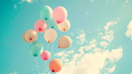 Colorful balloons flying in the sky with retro vintage filter effect for happy birthday celebrations, summer parties, and wedding honeymoon events - ideal for vintage backgrounds and festive occasions
