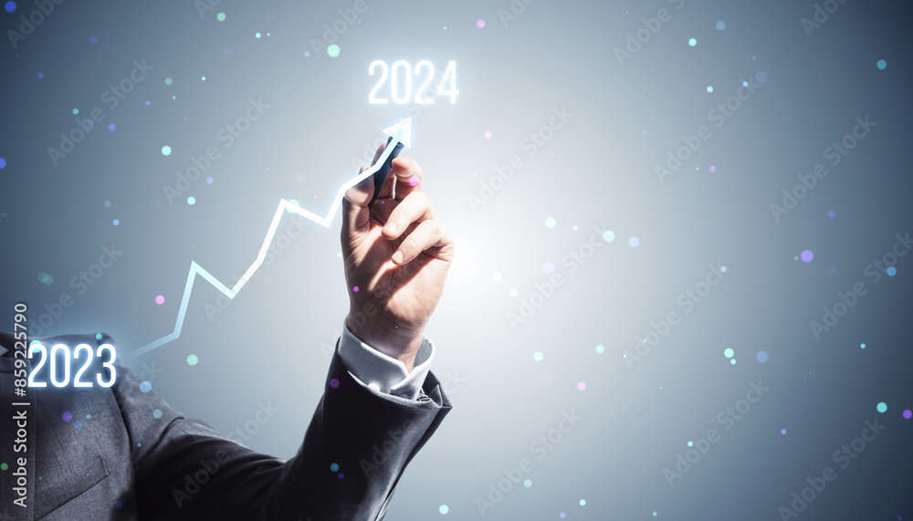 Poster a person in a suit drawing an ascending arrow from 2023 to 2024, indicating growth or progress on a 