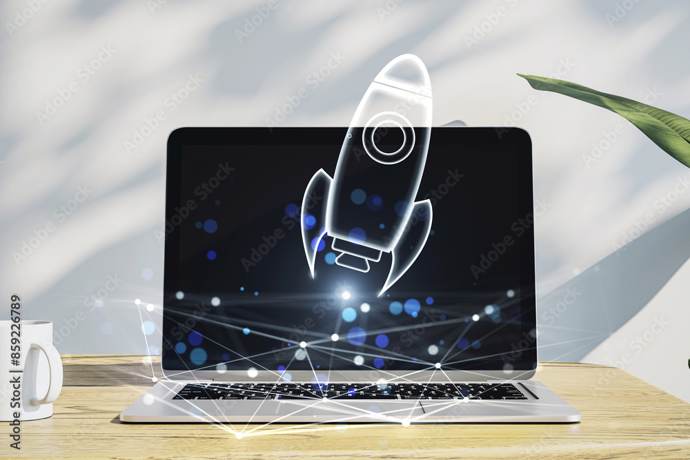 Poster A laptop on a desk showing a hologram of a rocket with a double exposure effect on a wooden and shadowed background, symbolizing innovation
