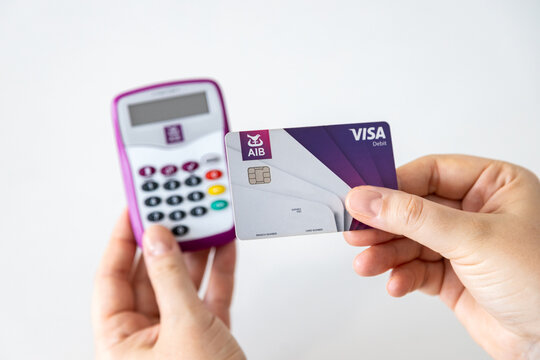 Hands using AIB (Allied Irish Banks) card reader for internet banking access