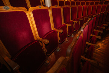 Fototapeta premium Row of red seats in theatre