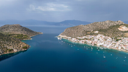 Fototapeta premium Aerial drone photo of famous seaside village small port and long sandy beach of Tolo with hotels and resorts built by the sea, Argolida, Peloponnese, Greece