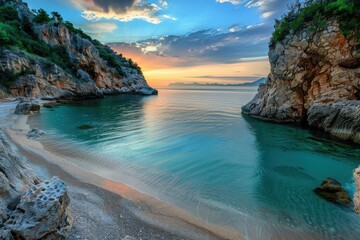 Fototapeta premium Tropical paradise awaits as the sun dips below the horizon, casting a warm glow on turquoise water lapping at a shore with smooth sand and dramatic rocks