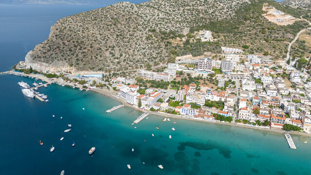 Aerial drone photo of famous seaside village small port and long sandy beach of Tolo with hotels and resorts built by the sea, Argolida, Peloponnese, Greece