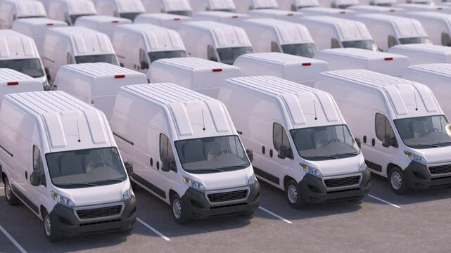 Delivery vans in a row on a parking. Express delivery service or car dealer selling concept.