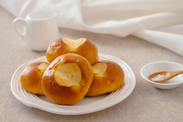 Pretzel buns on white plate