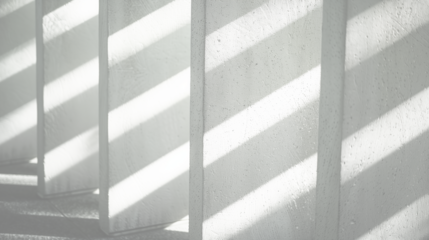 White concrete wall with shadow and sunlight. Abstract background and texture for design.