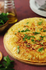 Frittata, traditional egg and potato omelette, Italian dish	