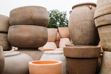 Ceramic terracotta flower pots in different sizes and shapes for sale at the garden center