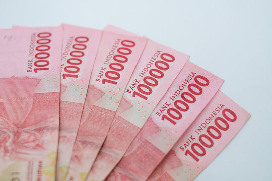 one hundred thousand rupiah banknotes on a white background. financial concept
