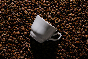 Coffee cup on coffee beans