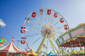 Bright photo of a Ferris wheel at a fair, capturing the essence of a festive Independence Day celebration