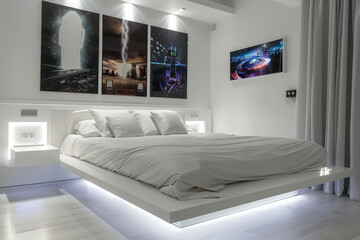A modern white bedroom with a floating bed, LED lighting, and futuristic posters above the headboard.