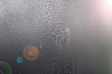 Water droplets with shining light background