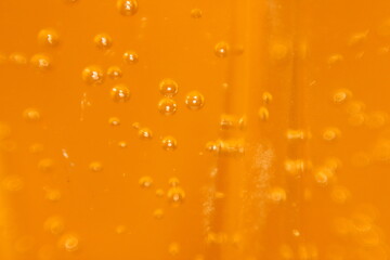 A close up of a glass with bubbles in it