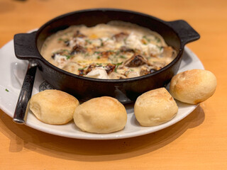 mushroom soup and bread on the table