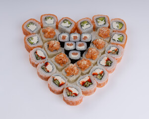 Heart shaped set of sushi rolls for Valentine's Day. Menu or delivery concept, Top view