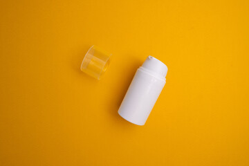 Container for cream, shampoo, toiletries, spa. Unbranded white plastic bottles. Bottle with a dispenser for cosmetic products. Skin care and beauty concept. Mockup style, copy space 