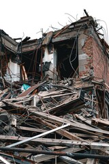 A large pile of debris and wreckage sitting outside a building, suitable for use as a background or prop for various scenes