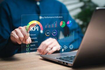 KPI, Key Performance Indicator business analysis, Goal setting concept, Businesswomen mark important topics KPI and show KPI dashboard on virtual screen Analyze graphs efficiently, Business target