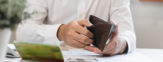 Close-up view of person hands opening empty wallet.