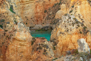 Lagoon with turquoise water among the rocks, Algarve , Portugal 