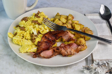 scrambles mixed with  sausage served with home fries