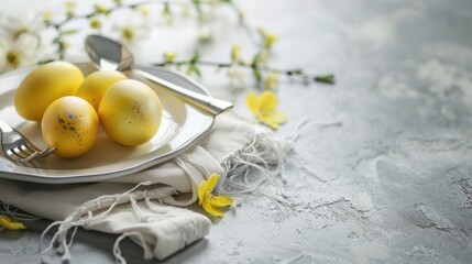Easter Table Decor with Silverware Yellow Eggs and Copy Space