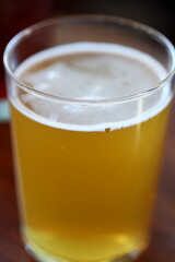 A single glass of freshly squeezed orange juice sitting on a table, great for breakfast or a snack