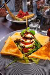 Avocado caprese salad on skewer with toast.