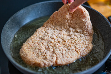Pork chop in frying pan
