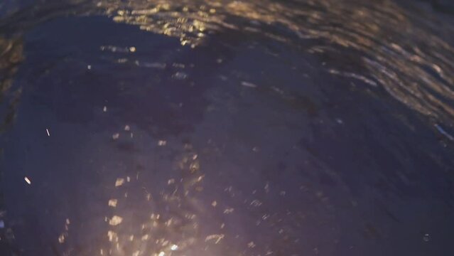 A Mesmerizing Vortex of Dark Water with Reflections of Light is a captivating sight in nature