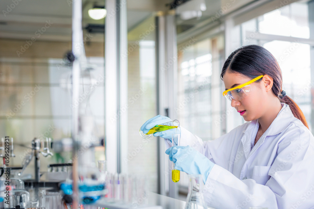 Canvas Prints attractive young asian scientist woman lab technician assistant analyzing sample in test tube at lab