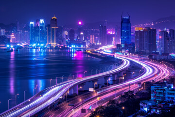 Fototapeta premium Long exposure photo of light trails from cars on highway over the city at night