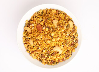 Traditional Indian deep fried salty dish called chivda or mixture or farsan made of gram flour and mixed with dry fruits