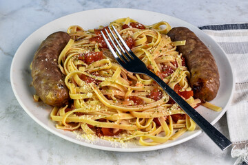 fettuccine  with diced tomatoes a nd with  sausage